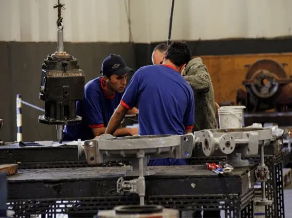 FB Bombas technical team assembling industrial pumps for LATAM export