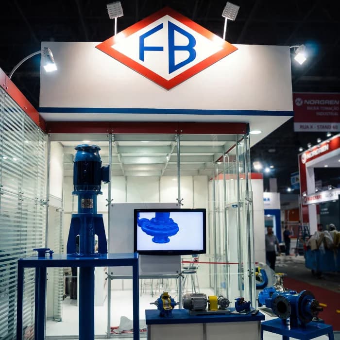 FB Bombas booth at industrial trade show with pumps and products on display